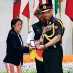 His wife receiving "Sena Medal"