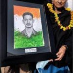 2nd Lt Gurdeep Singh Salaria's mother with his portrait